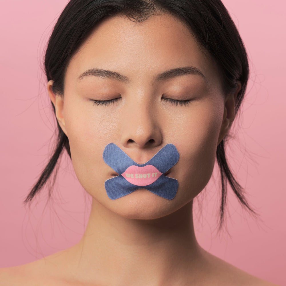 We Shut It model wearing We Shut It mouth tape for better sleep.