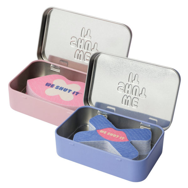 We Shut It mouth tapes for better sleep in a We Shut It glowing tin with the lips open showing the mouth tapes. 