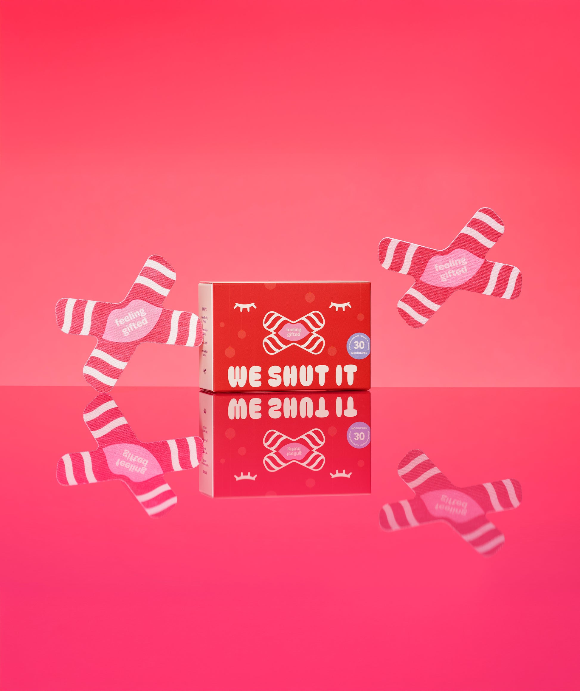 We Shut It bamboo fibre mouth tapes for better sleep with affirmation: "feeling gifted" against a ed background. 